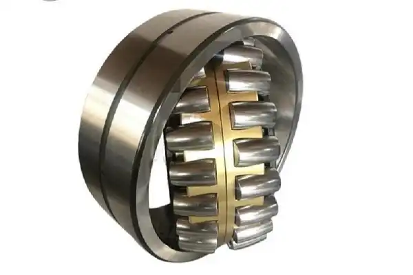 How do spherical roller bearings absorb heavy radial and axial loads?